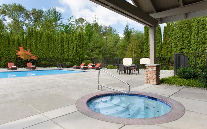 a swimming pool with a covered patio