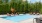 a swimming pool with chairs around it