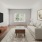 a living room with a tv and couches