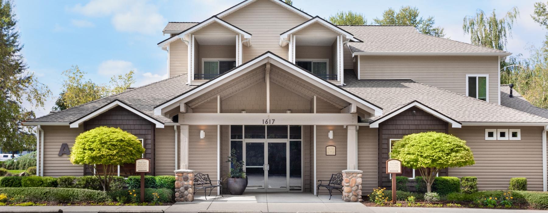 a large house with a parking lot