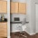 a kitchen with a chair and a table
