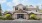 a large house with a parking lot