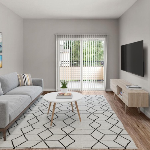 Relax and unwind in well-lit living areas a living room with a couch and a table