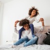 woman and girl on a bed