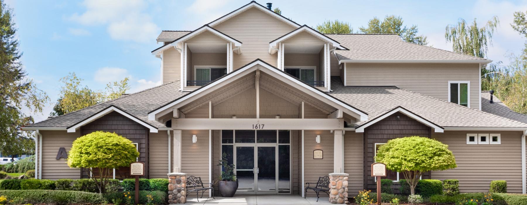 a large house with a parking lot