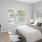 a bedroom with a large window