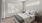 a bedroom with a bed and lamps