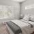 a bedroom with a bed and lamps